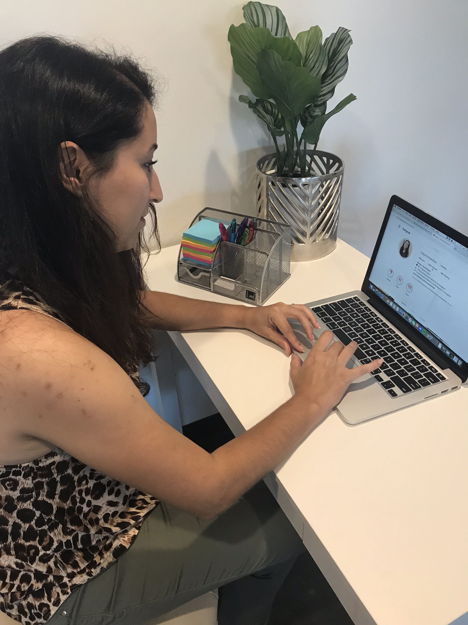 Instagram Expert Naty Montandon on her computer at a desk